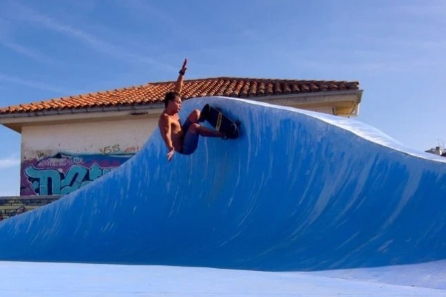 a man flying through the air while riding a snowboard